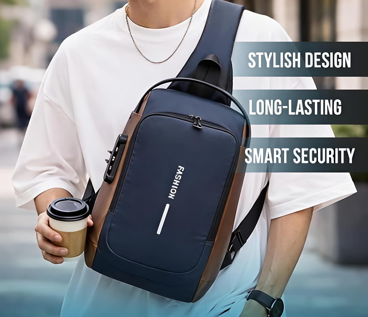 Person wearing a navy blue crossbody bag with brown accents, holding a coffee cup, on a blurred street background.